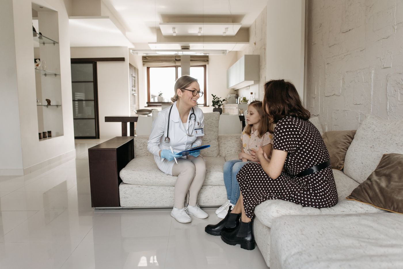 A doctor consulting with a parent and child