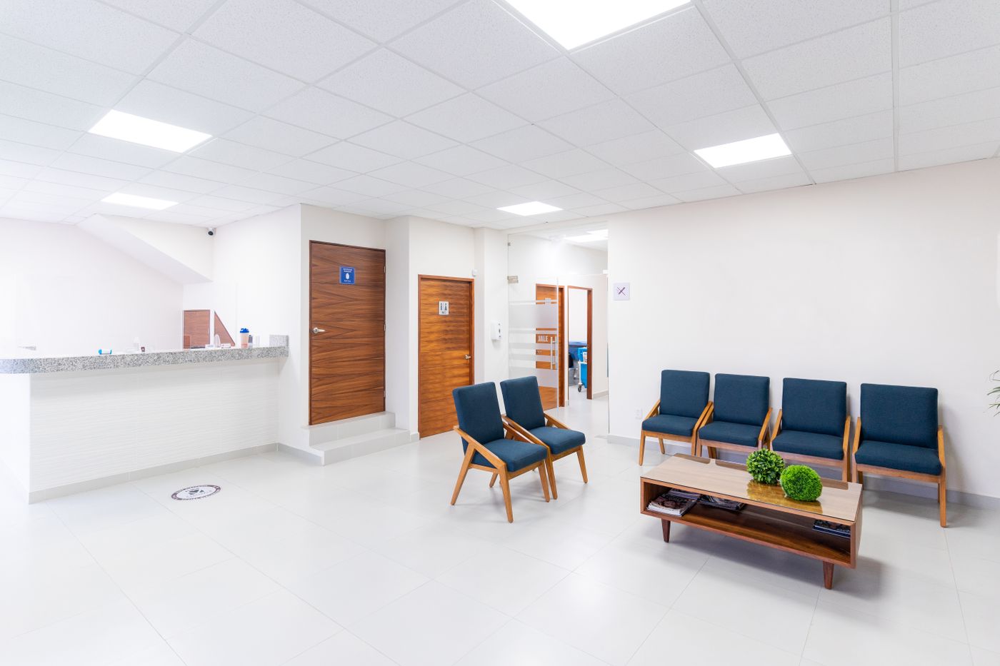 A bright, modern hospital reception and waiting area