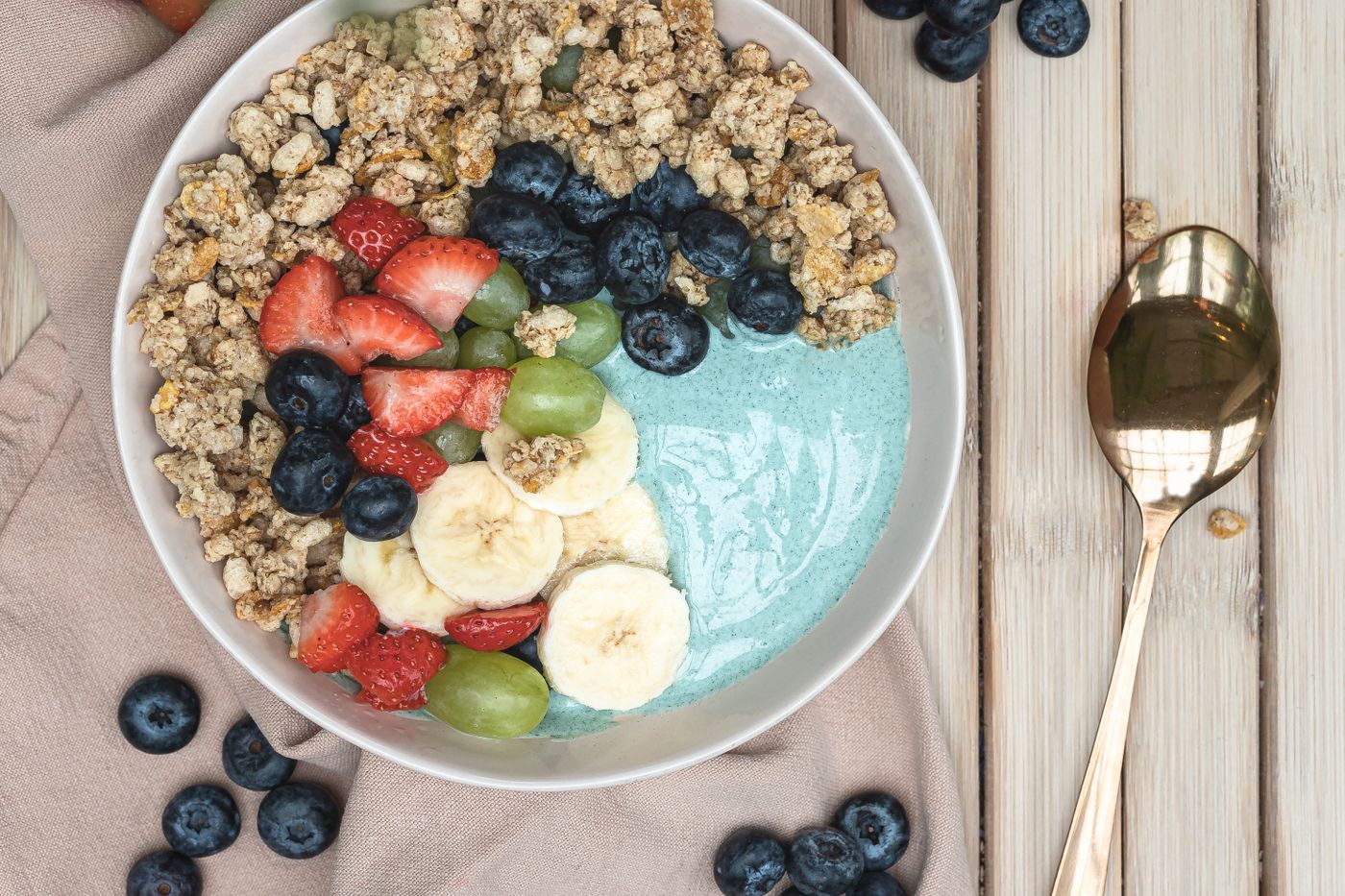 A bowl of fresh fruit and healthy breakfast foods